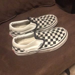Black and white slip on Vans